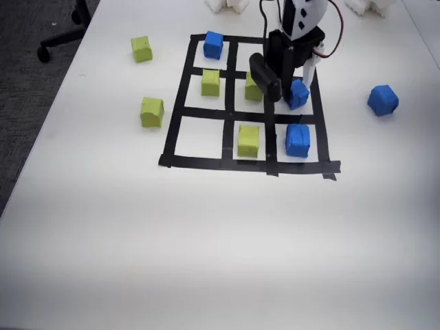 Teaching a Robot Arm to Play Tic-Tac-Toe